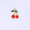Close-up detail of a cute 3D cherry pendant with green leaves and red fruit for DIY jewelry. - Style B