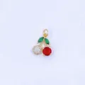 Detailed shot of gold-plated cherry pendant featuring green leaves, white and red cubic zirconia. - Style H