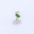 Detailed view of gold-plated cherry pendant featuring green and white cubic zirconia stones. - Style J
