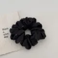 Black satin rhinestone hair scrunchie detail view, elegant hair accessory for women. - Black
