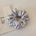 Silver satin rhinestone hair scrunchie detail view, elegant shiny hair tie for women ponytails. - Gray