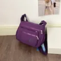 Borsa a tracolla multifunzione in nylon viola, borsa da viaggio casual capiente per donna. - Viola