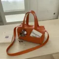 Stylish orange leather shoulder bag, large capacity daily tote and casual handbag for women. - With Horse Charm / Orange