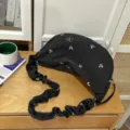 Black canvas crescent crossbody bag with cute white bow prints and stylish scrunchie shoulder strap. - Basic Style / Black