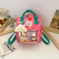 Pink heart pattern backpack with green straps, clear front pocket and cute plush pendant. - Pink (No Charm)