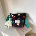 Cute canvas shoulder bag for women with colorful heart print, green straps and plush charm. - Black (No Pendant)