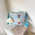 Blue canvas crossbody bag featuring cute heart prints and a fluffy white plush pendant. - Blue (No Pendant)