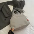 Casual grey canvas crossbody backpack for women, stylish Korean style travel daypack bag. - Gray