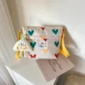 Cute canvas crossbody bag for women with colorful heart print and yellow strap daily use - Beige (No Charm)