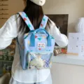 Light blue cute printed backpack with clear front pocket for daily travel and school use. - Blue + Cheese Pendant