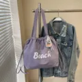 Sac à bandoulière en nylon violet avec cordon de serrage, grand cabas fourre-tout tendance. - Violet