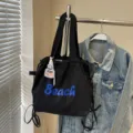 Sac à bandoulière en nylon décontracté pour femme, léger, polyvalent, grand fourre-tout. - Noir