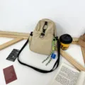 Casual lightweight canvas crossbody bag for women, versatile beige daily small backpack with strap. - With Pendant / Khaki