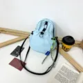 Light blue mini backpack casual crossbody bag stylish shoulder bag for women and daily use. - With Pendant / Blue
