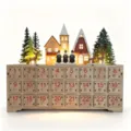 Wooden Christmas advent calendar detail featuring glowing German village scene and numbered drawers. - 34.5x8x28cm / Original Color