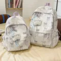 Cute Japanese style white backpack with purple bows and plush star pendant for school girls. - Small (With Blue Star Keychain) / Purple