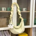 Yellow hobo shoulder bag with pleated strap and cute pendant for women daily casual commute. - With Pendant / Yellow