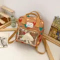 Cute heart print mini backpack with clear front pocket and kawaii plush charm for daily use. - Khaki + Cheese Pendant