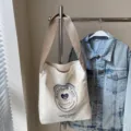 Casual canvas shoulder bag for women, large capacity daily tote bag with stylish print. - White