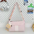 Casual large capacity canvas crossbody bag for women, stylish pink travel shoulder bag with cute charm. - With Long-Legged Cookie Pendant / Pink