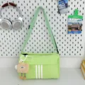 Light green canvas messenger bag casual crossbody bag with cute toast pendant and stripes. - With Long-Legged Cookie Pendant / Green