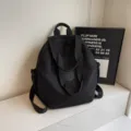 Black large capacity lightweight backpack, stylish minimalist design travel book bag. - Black