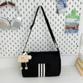 Black canvas crossbody bag with white stripes casual daily shoulder bag stylish storage. - With Long-Legged Cookie Pendant / Black
