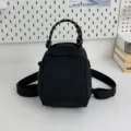 Black canvas mini backpack handbag, casual multifunctional shoulder crossbody shell bag style. - Black