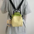 Small canvas backpack variant, green and yellow color block, casual travel daypack. - With Plush Pendant / Yellow