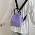Purple canvas small backpack, casual shoulder crossbody shell bag for women travel and daily use. - With Plush Pendant / Purple