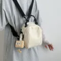 Lightweight beige canvas mini backpack with black-white braided handle and cute plush pendant. - With Plush Pendant / White