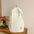 Minimalistischer weißer Rucksack mit großem Fassungsvermögen für Schule und Reise. - Weiß