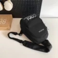 Black waterproof multi-functional chest bag for men and women, casual crossbody sling bag for daily travel. - Black