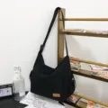 Black canvas crossbody bag large capacity casual messenger bag for women and men daily use - Black