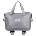 Grey foldable travel duffel bag with universal wheels, large capacity luggage storage bag. - Gray