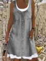Close-up of gray denim sleeveless button-down fake two-piece dress with dual pockets. - S / Dresses / Gray