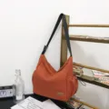 Large capacity orange canvas messenger bag, casual shoulder bag with wide strap for travel. - Orange