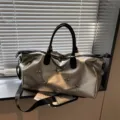 Silver metallic travel duffel bag with black handles and edgy star studs for women - Silver With Stars