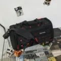 Large capacity multi-functional sports duffel bag for gym, travel, and outdoor hiking trips. - Black Red