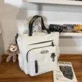 Large capacity white canvas tote bag with multiple pockets and shoulder strap for daily use. - White + Pendant / White