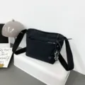 Casual black nylon crossbody bag for women, lightweight waterproof shoulder bag with wide strap. - With Pendant / Black