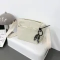 Women's casual nylon messenger bag with wide strap and cute keychain for daily use. - With Pendant / Ivory