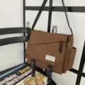 Japanese workwear canvas messenger bag for men and women, large capacity casual crossbody bag. - Brown