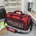 Red large capacity sports duffel bag for gym and travel, durable waterproof training bag. - Red