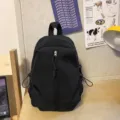 Casual black minimalist backpack for daily school and outdoor travel, lightweight design. - Regular Fit / Black