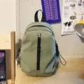 Lightweight casual backpack for daily travel, compact green daypack with zipper pocket. - Regular Fit / Green