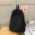 Casual black minimalist backpack for daily school and outdoor travel use, durable and stylish. - L / Backpack / Black