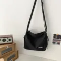 Japanese solid color canvas crossbody bag, casual minimalist shoulder messenger bag for daily use. - Basic Style / Black