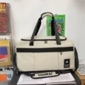 Large capacity travel duffel bag for gym, sports, and short trips with comfortable straps. - Khaki