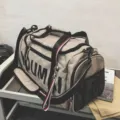 Large capacity travel duffel bag with black straps, perfect for gym, sports, and short trips. - Gray